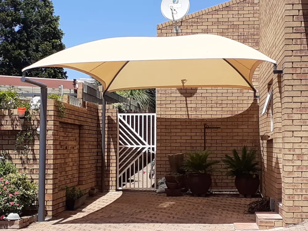 Cream shade sail, courtyard carport